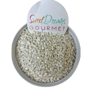 a bowl filled with white beans and a sign that says sweet dreams gourmet