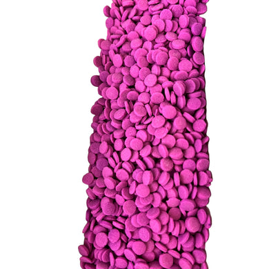 a large pile of purple pebbles on a white background