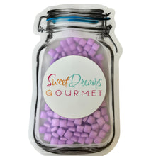 a jar filled with pink and purple marshmallows