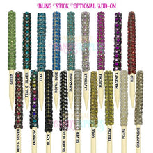 a bunch of different colored beads on a stick