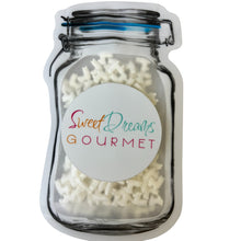 a jar filled with white sugar sprinkles