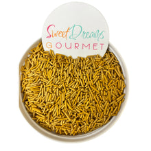 a bowl filled with yellow sprinkles and a sign that says sweet dreams