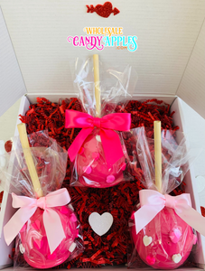 a box of valentine's day treats with a pink bow