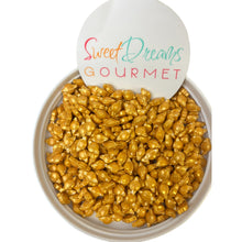 a bowl filled with nuts next to a sign that says sweet dreams gourmet