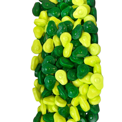 a pile of green and yellow gummy bears