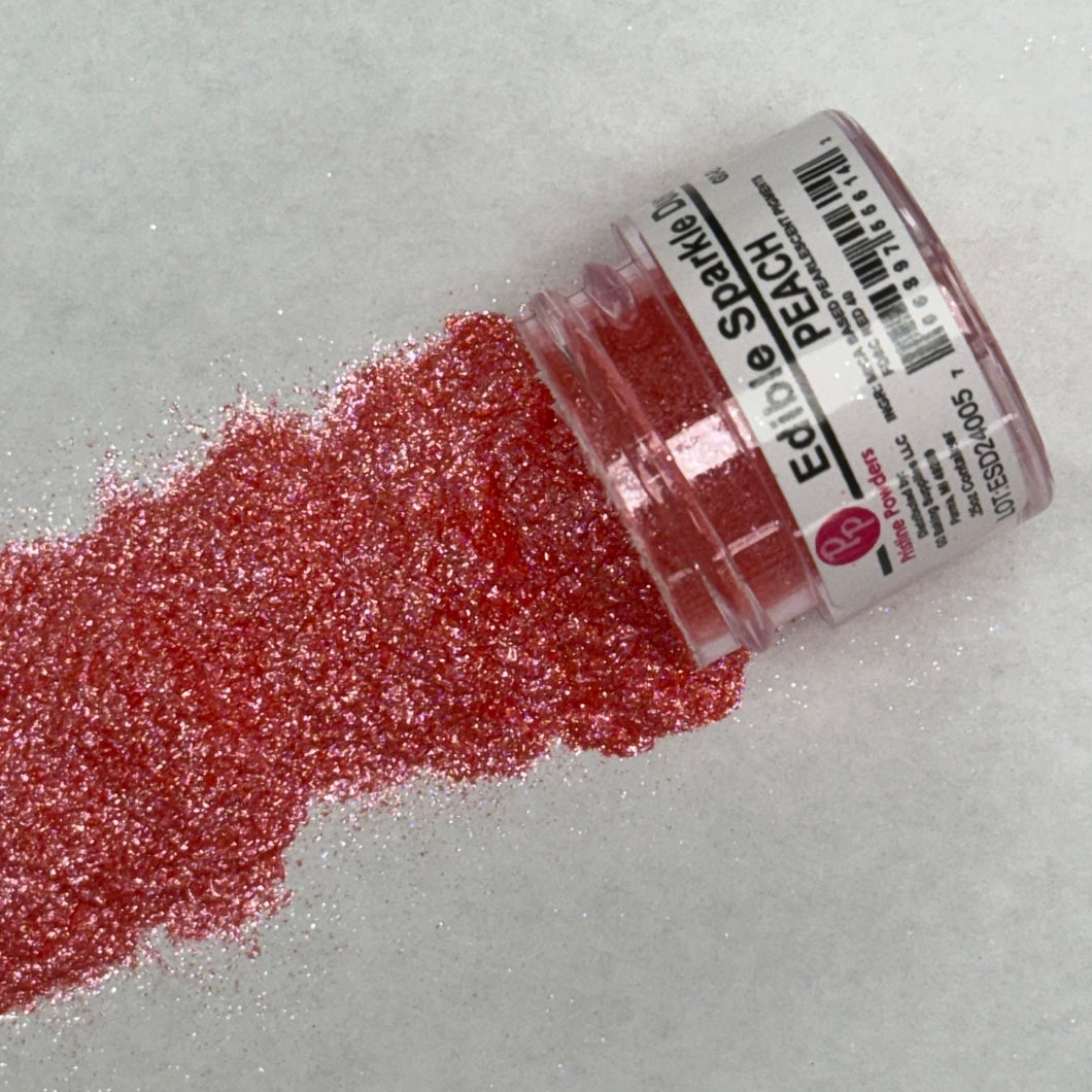 a bottle of red glitter sitting on top of a table