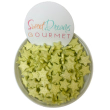 a bowl filled with green star shaped treats