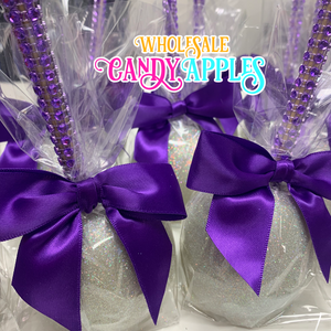 a close up of candy balls with purple bows