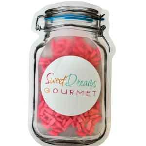 a jar filled with pink and red candy