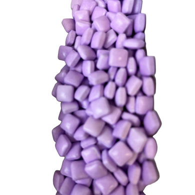 a pile of purple candies sitting on top of each other
