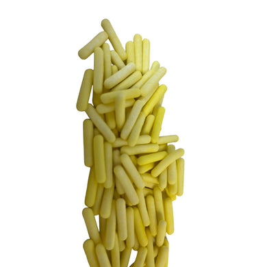 a pile of small yellow objects against a white background