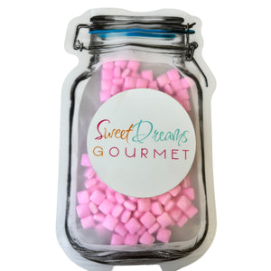 a jar filled with pink and purple marshmallows