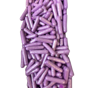 a pile of purple pills sitting next to each other