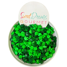 a bowl filled with green leaves next to a sign that says sweet dreams gour