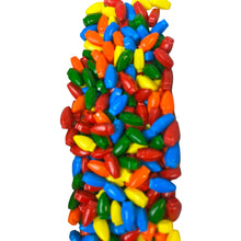 a pile of multi colored candies on a white background