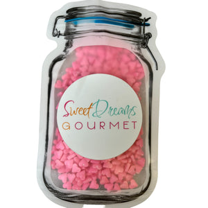 a jar filled with pink and pink hearts