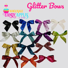 a group of different colored bows on a white background