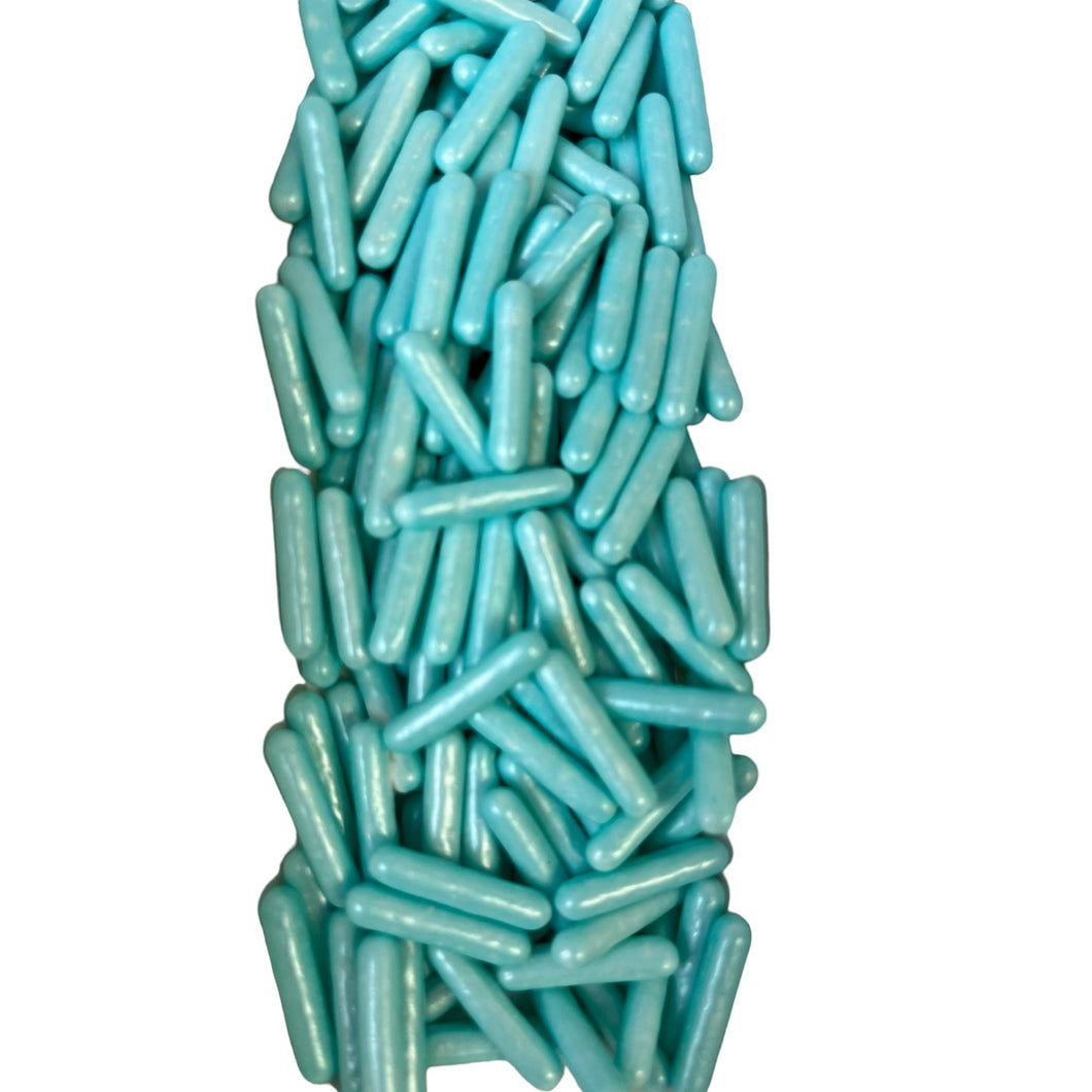 a pile of blue pills on a white background