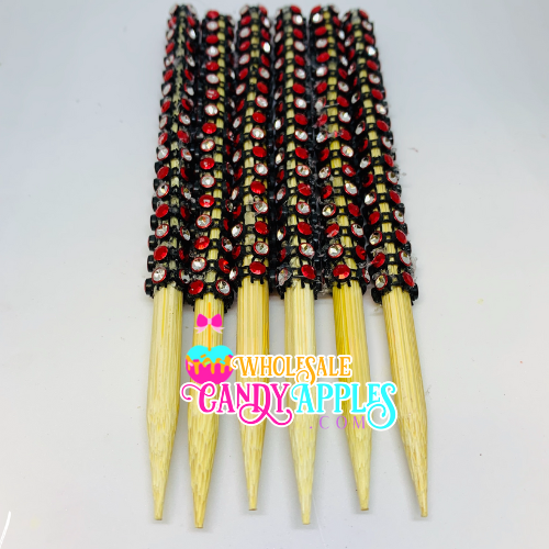 a close up of a bunch of sticks with beads on them