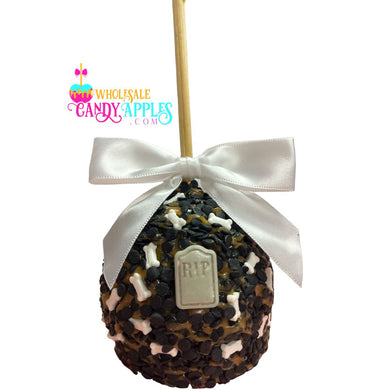 A candy apple with a white ribbon and a 