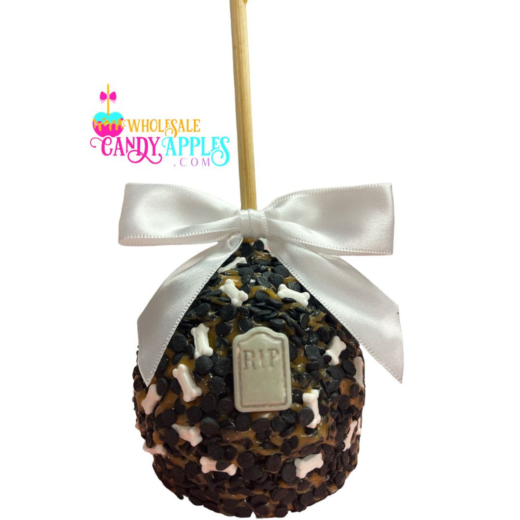A candy apple with a white ribbon and a 