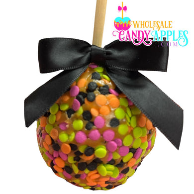 A colorful candy apple with a black ribbon tied around it, featuring a variety of multicolored candies.