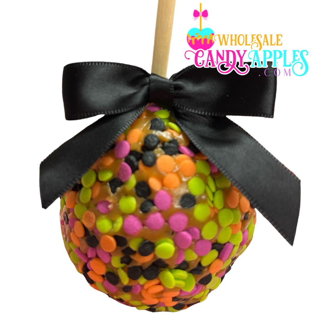 A colorful candy apple with a black ribbon tied around it, featuring a variety of multicolored candies.