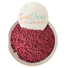 a bowl filled with pink gravel next to a sign that says sweet dreams gour