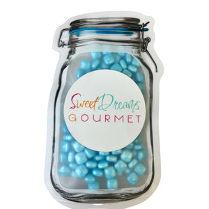 a jar filled with blue and white candy