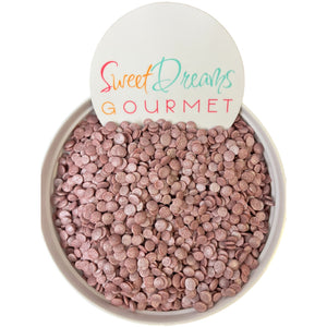 a bowl filled with pink gravel next to a sign that says sweet dreams gour