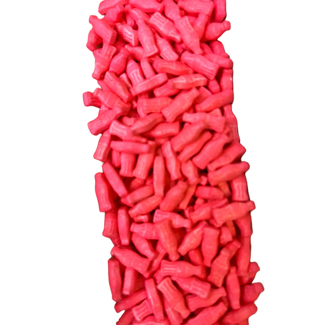 a large pile of pink candy canes on a white background