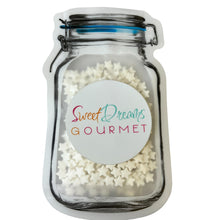 a jar filled with white sugar sprinkles