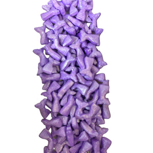 a pile of purple candy sticks sitting on top of each other