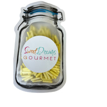 a glass jar filled with yellow pasta noodles