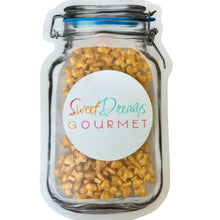 a jar of sweet treats with a sticker on it