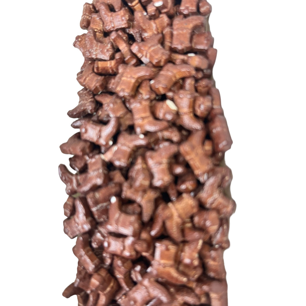 a sculpture made of chocolate pieces on a white background