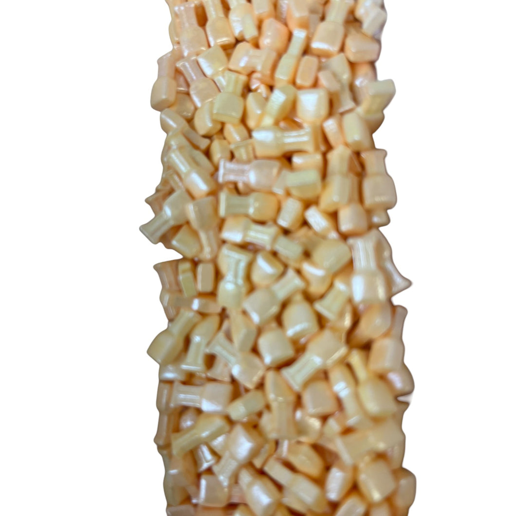 a pile of corn sitting on top of a white table