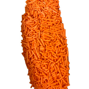 a large pile of carrots sitting on top of a white surface