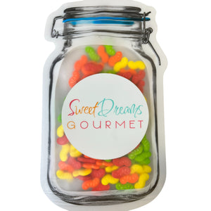 a jar filled with gummy bears sitting on top of a table