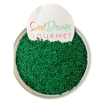 a bowl of green sprinkles with a sign that says sweet dreams go