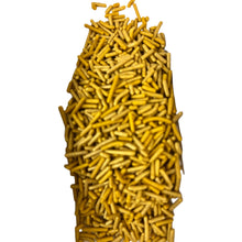 a pile of yellow sprinkles sitting on top of each other