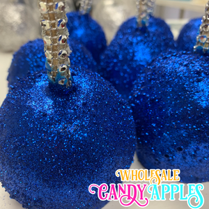a close up of blue candy apples on a table
