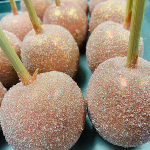 a close up of a bunch of candy apples