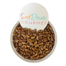 a bowl of roasted coffee beans with a sign that says sweet dreams gourmet