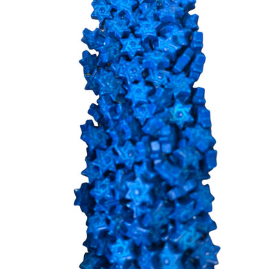 a close up of a blue object on a white background