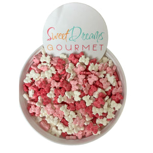 a bowl filled with pink, white and pink sprinkles