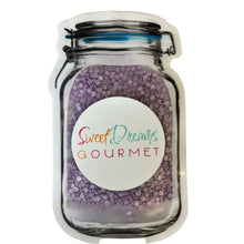 a jar filled with purple beans and a label that says sweet dreams gourmet