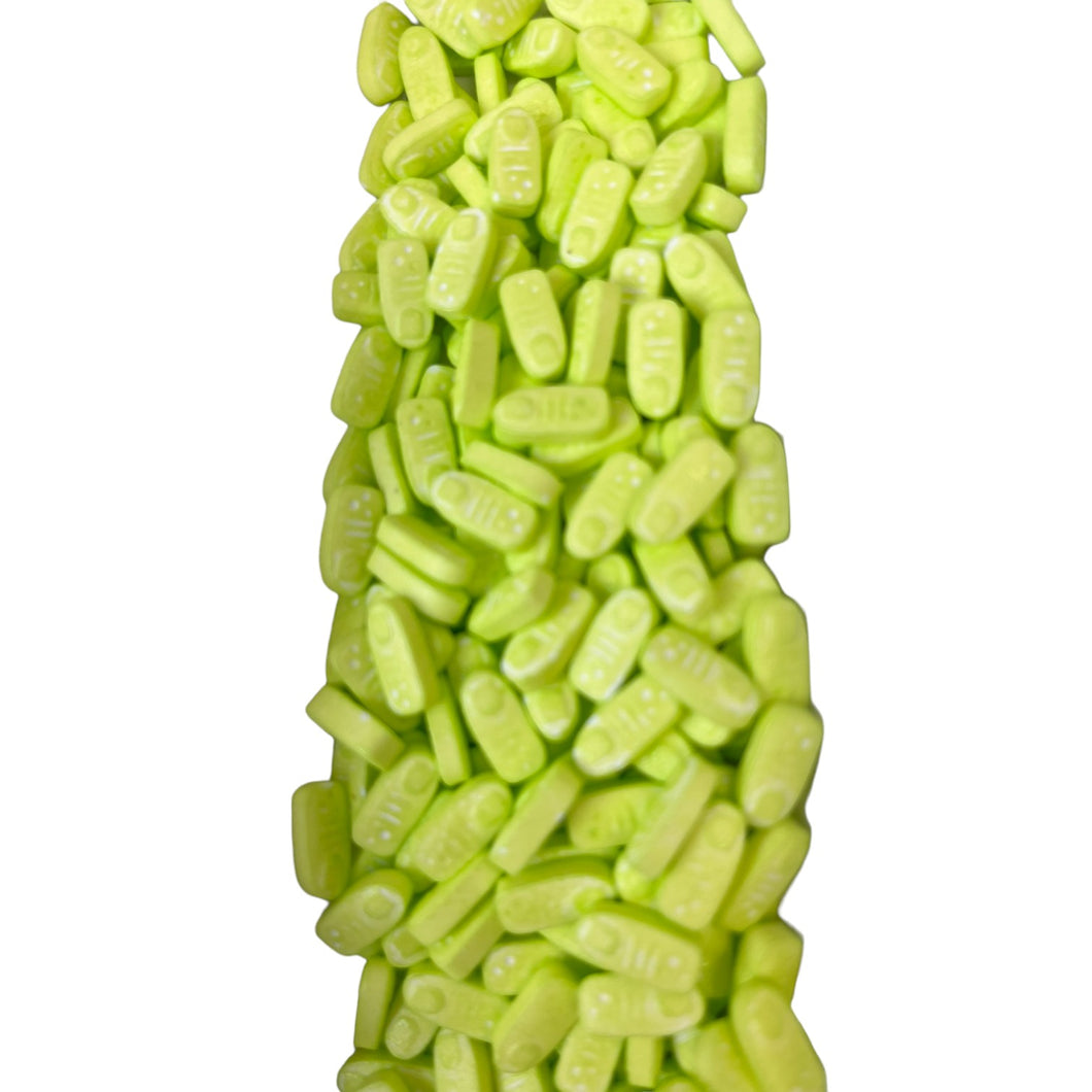 a pile of green candies sitting on top of each other