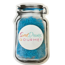 a jar filled with lots of blue sprinkles