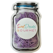 a jar filled with purple candy sticks